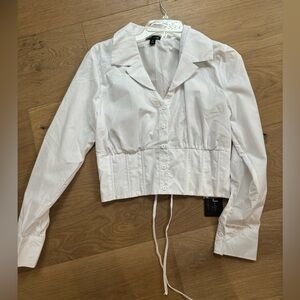 Médium. Never worn. Tags still on
